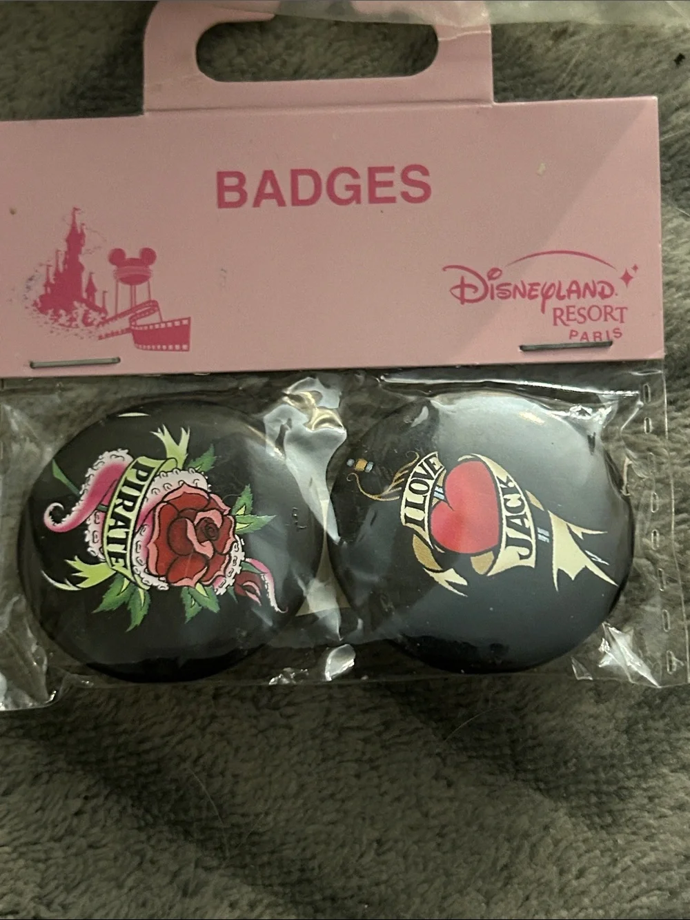 Disneyland resort pirates of the Caribbean set of 2 small badges.